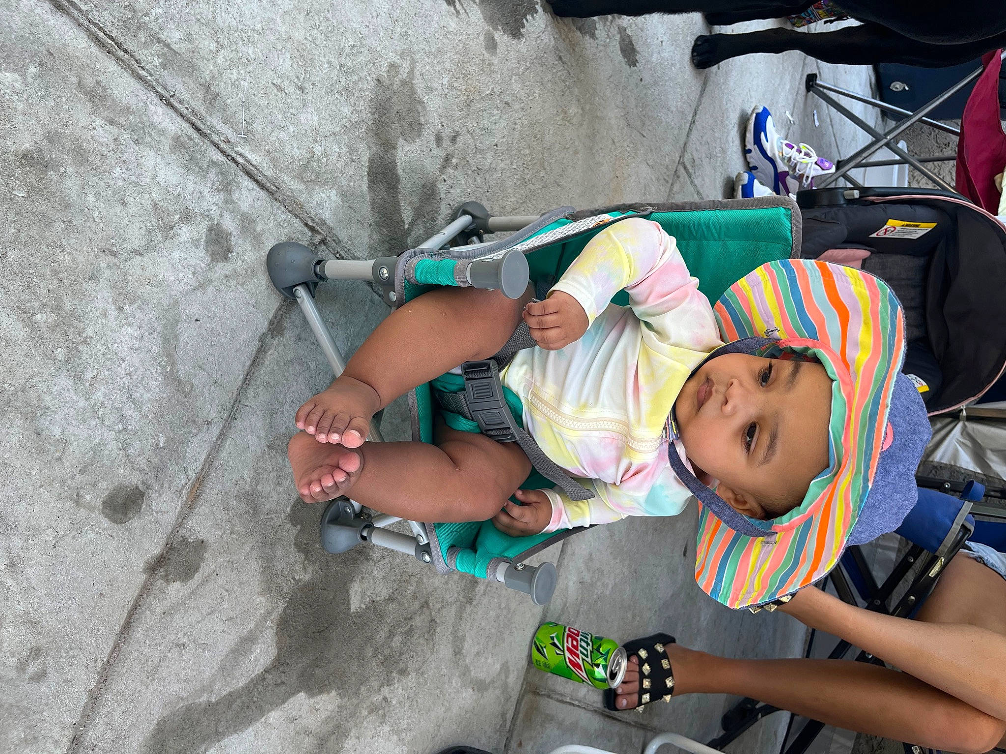Dyonnah is registered to the contest to win money with this photo: adventure, baby, baby_carriage, baby_products, bicycle_frame, bicycle_handlebar, child, concrete, fun, hat, headwear, leisure, person, personal_protective_equipment, recreation, sandal, shorts, thigh, tire, toddler