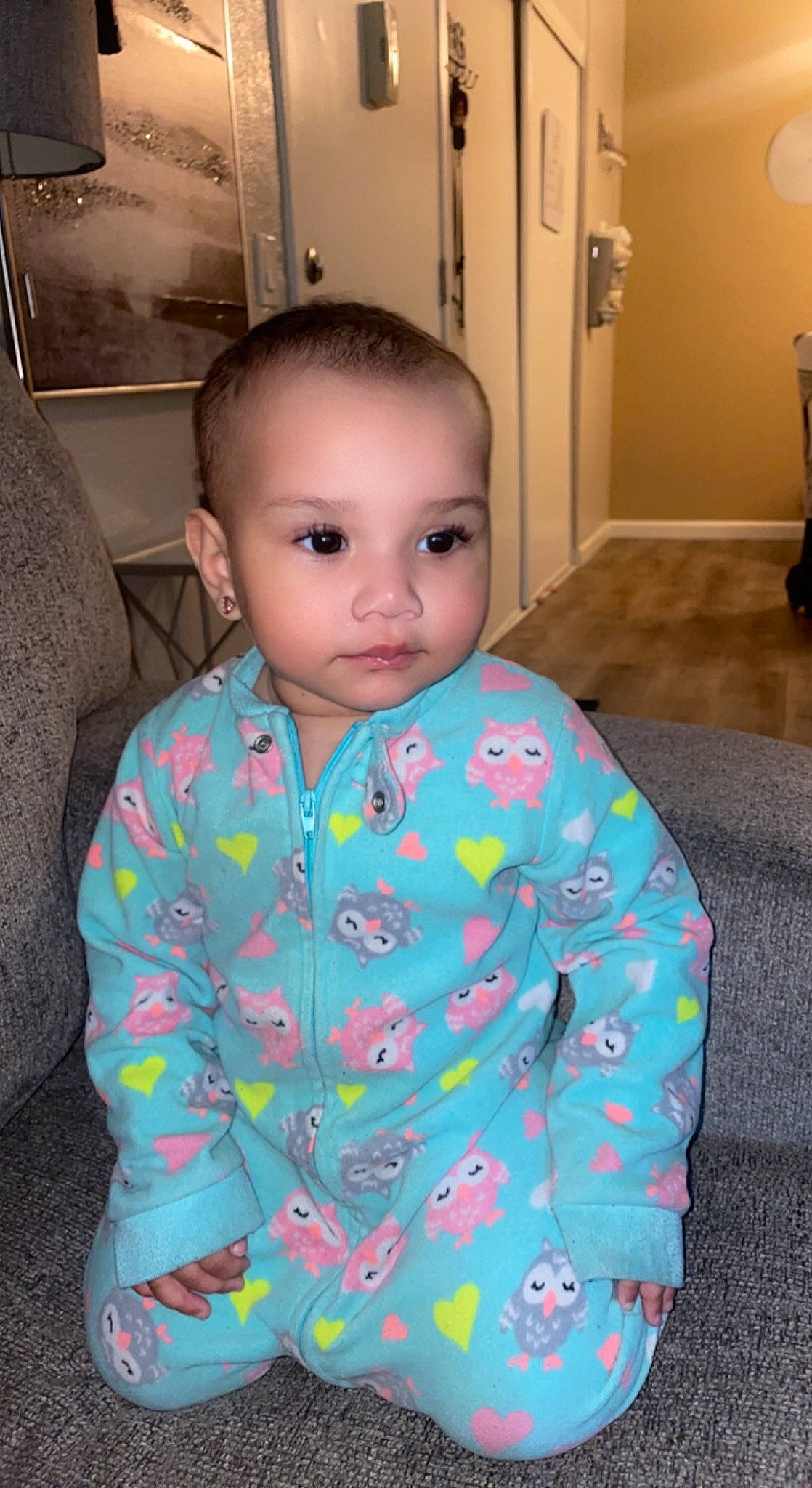 Miah is registered to the contest to win money with this photo: baby_toddler_clothing, cheek, child, chin, dress_shirt, eye, eyebrow, eyelash, face, flooring, head, iris, nose, pattern, person, room, sitting, skin, sleeve, toddler