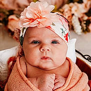 Starla joined the competition — help win amazing prizes! baby, infant, wrapped, blanket, headband, flower, pink, cute, portrait, face, skin, hands, newborn, soft, warm, cozy, closeup, child, eyes, indoor