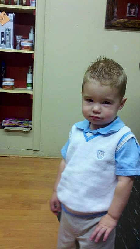 Preston is registered to the contest to win money with this photo: baby_toddler_clothing, bookcase, chin, dress_shirt, electric_blue, floor, flooring, hairstyle, hardwood, joint, nose, person, shelf, shelving, shoulder, skin, sleeve, t_shirt, toddler, wood