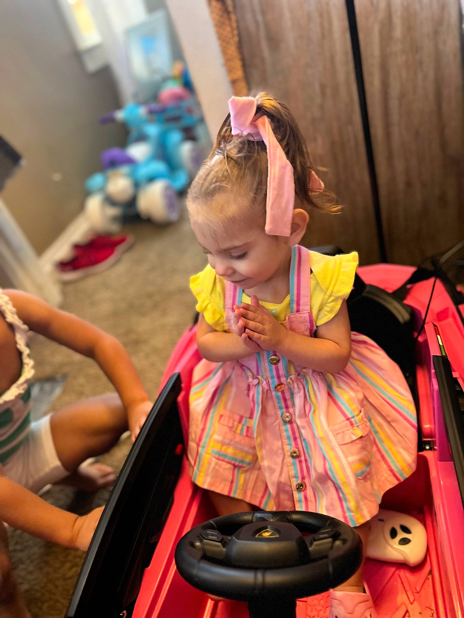 Kaykay is registered to the contest to win money with this photo: baby, baby_carriage, baby_products, bag, child, costume, event, eyewear, fashion_accessory, fun, hairstyle, happy, leisure, magenta, person, pink, product, room, sitting, toddler