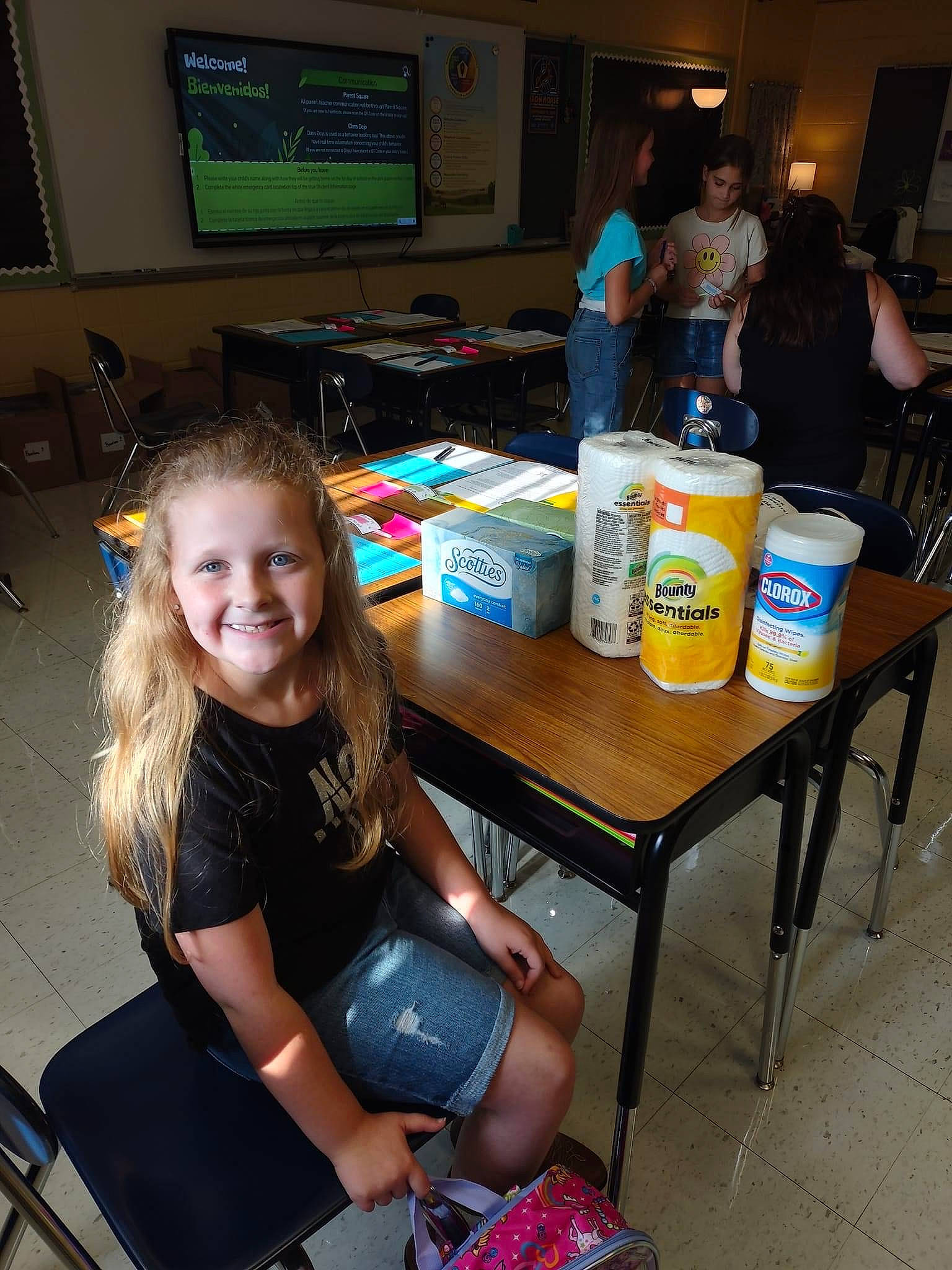 Isabella joined the competition — help win amazing prizes! arm, chair, child, display_device, event, flooring, fun, furniture, human_leg, joy, lap, leisure, person, play, room, sitting, smile, sock, t_shirt, table