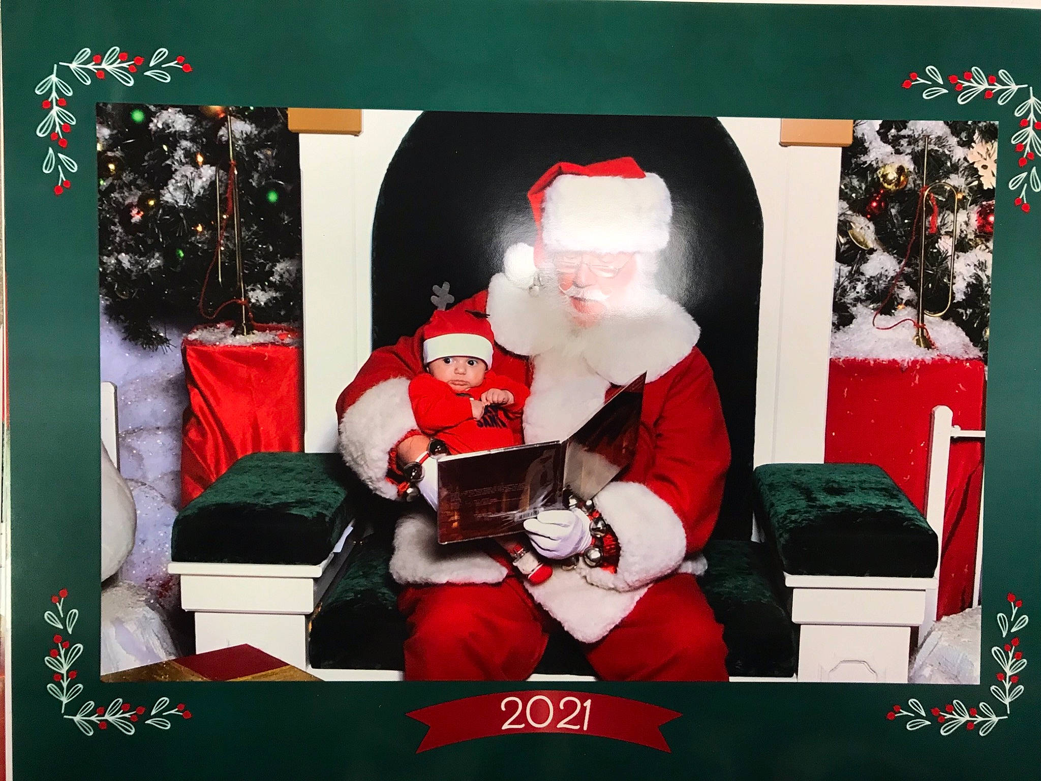 Braylin joined the competition — help win amazing prizes! advertising, carmine, christmas, christmas_decoration, christmas_eve, christmas_ornament, display_device, event, fictional_character, font, hat, headwear, holiday, interior_design, lap, person, photo_caption, rectangle, red, room