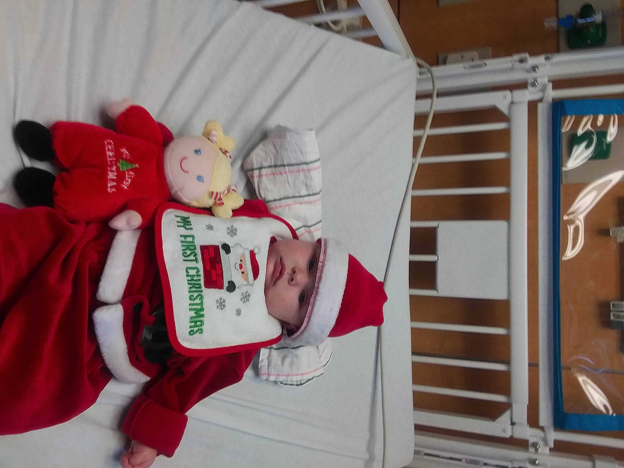 Jaylee is registered to the contest to win money with this photo: baby_toddler_clothing, carmine, christmas, christmas_eve, fictional_character, fur, headwear, mascot, person, plush, red, stairs, stuffed_toy, teddy_bear, textile, toy