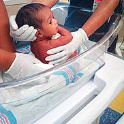 Gabriella joined the competition — help win amazing prizes! newborn, baby, infant, hospital, bassinet, medical, healthcare, gloves, nurse, caregiver, birth, swaddling, blanket, portrait, profile, face, head, indoors, newborn_care, family