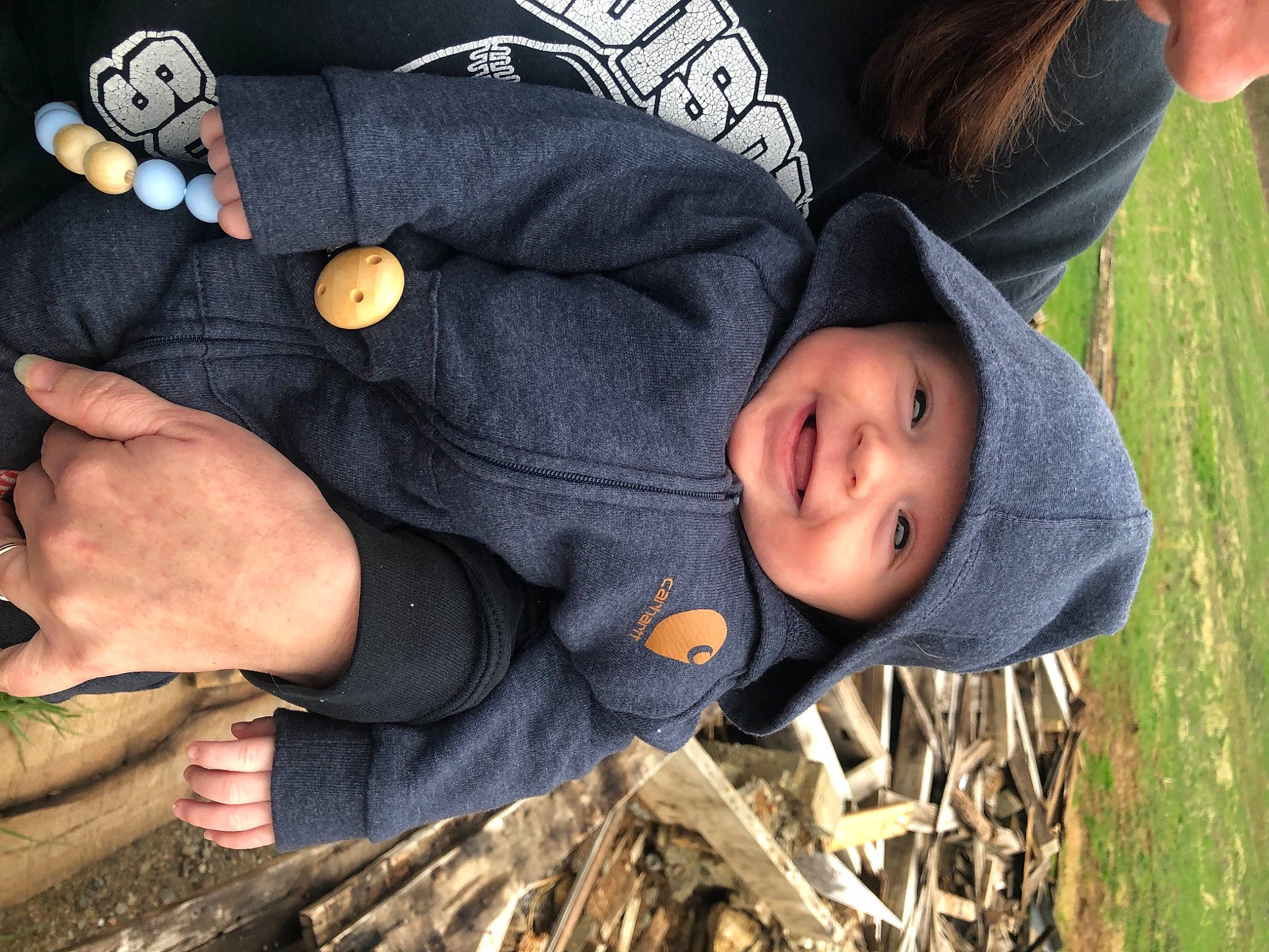 Haiden joined the competition — help win amazing prizes! baby, baby_toddler_clothing, button, child, fun, gesture, grass, hand, happy, headwear, joy, nail, outerwear, people, people_in_nature, person, sitting, sleeve, thumb, toddler