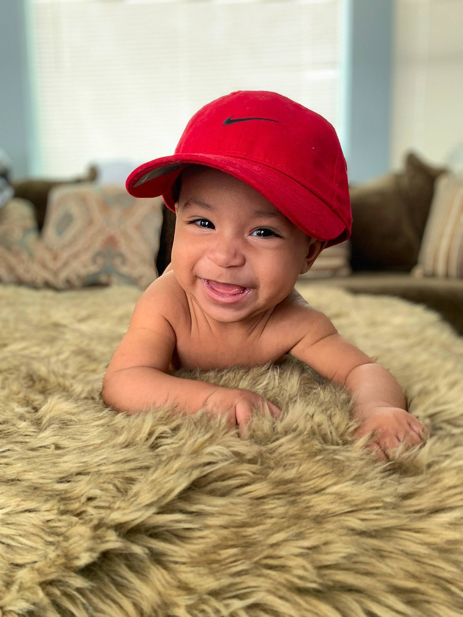 Romeo is registered to the contest to win money with this photo: baby, baby_toddler_clothing, baseball_cap, cap, child, chin, comfort, eye, face, fashion_accessory, flash_photography, flooring, grass, happy, headgear, headwear, joy, lip, person, skin