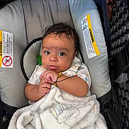 Isaac is registered to the contest to win money with this photo: adorable, baby, blanket, bundle, car_seat, child, clothing, comfort, cute, expression, face, hands, indoor, infant, newborn, person, portrait, resting, seat, soft