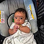 adorable, baby, blanket, bundle, car_seat, child, clothing, comfort, cute, expression, face, hands, indoor, infant, newborn, person, portrait, resting, seat, soft