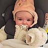 Cassie a rejoint le concours — aidez-le/la à gagner de superbes lots ! baby, pacifier, hat, car_seat, jacket, blanket, infant, cute, child, warm_clothing, seatbelt, indoor, face, portrait, expression, sitting, closeup, soft_texture, animal_design, cozy