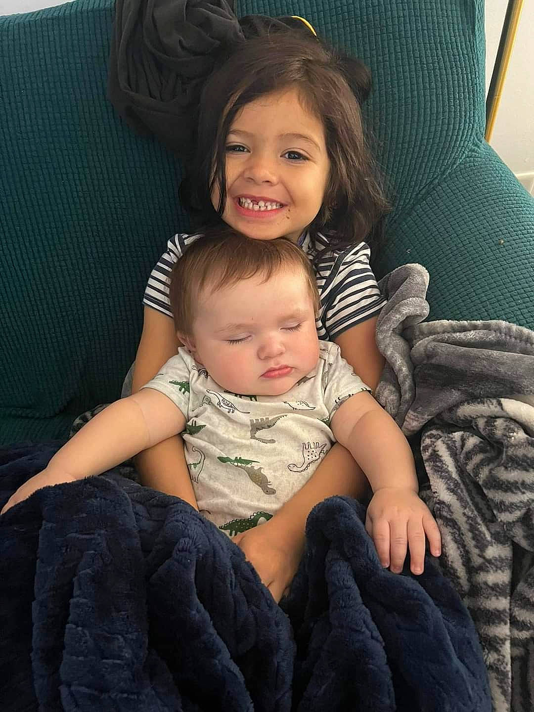 Ryleigh joined the competition — help win amazing prizes! cheek, child, comfort, couch, eye, face, facial_expression, finger, flash_photography, hairstyle, happy, human, interaction, joy, lap, leg, person, skin, smile, standing