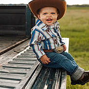Hendrix joined the competition — help win amazing prizes! toddler, child, cowboy_hat, striped_shirt, jeans, boots, belt_buckle, smiling, outdoor, grass, truck_bed, portrait, happy, blue_eyes, baby, western, hat, sitting, cute, fashion