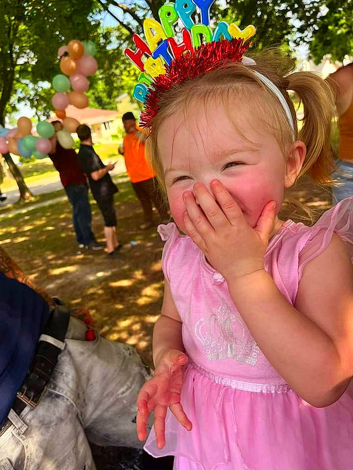 Serenity is registered to the contest to win money with this photo: child, event, fun, gesture, grass, happy, human, leaf, leisure, magenta, party_supply, person, pink, plant, public_event, recreation, shorts, spring, summer, toddler