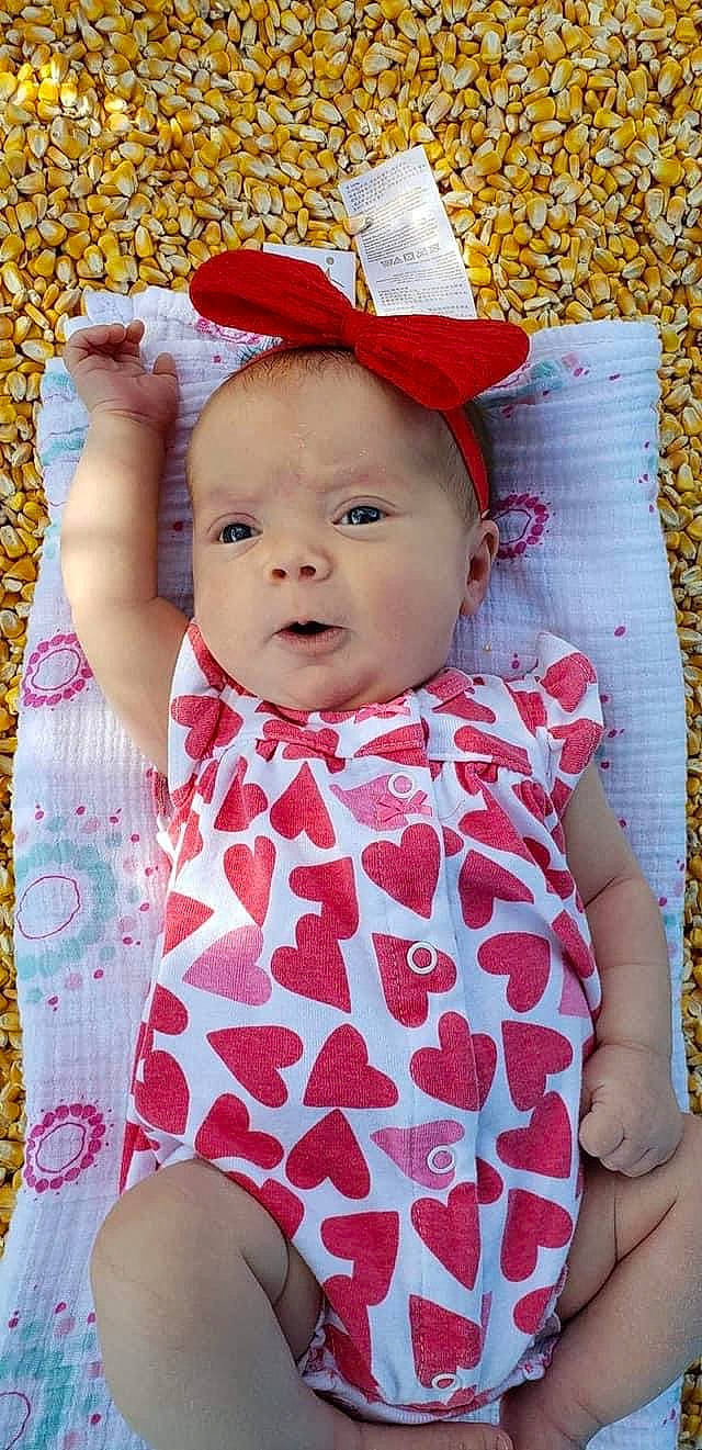 Jolena is registered to the contest to win money with this photo: baby, baby_products, baby_toddler_clothing, child, headgear, pattern, person, pink, product, textile, toddler