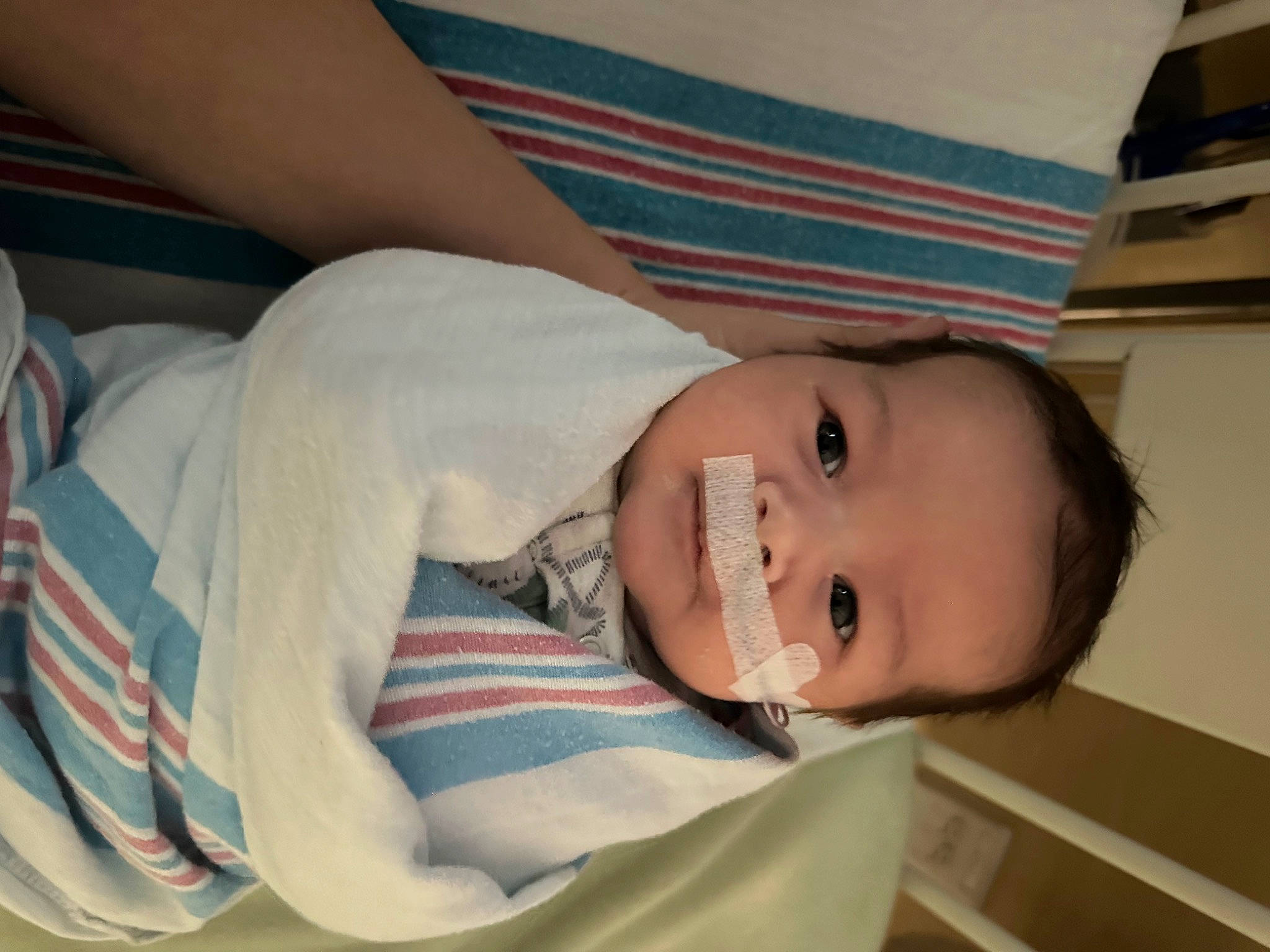 Luka is registered to the contest to win money with this photo: baby, baby_products, baby_toddler_clothing, cheek, child, comfort, elbow, happy, hat, linens, nose, pattern, person, room, skin, sleeve, smile, toddler, wood