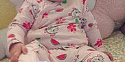 Myana participe au concours pour gagner de l'argent avec cette photo : baby, child, infant, smiling, pink_onesie, watermelon_print, flower_print, couch, floral_pattern, cushion, soft_toys, happy, tongue_out, indoors, cute, sitting, person, young_child, playful, cozy