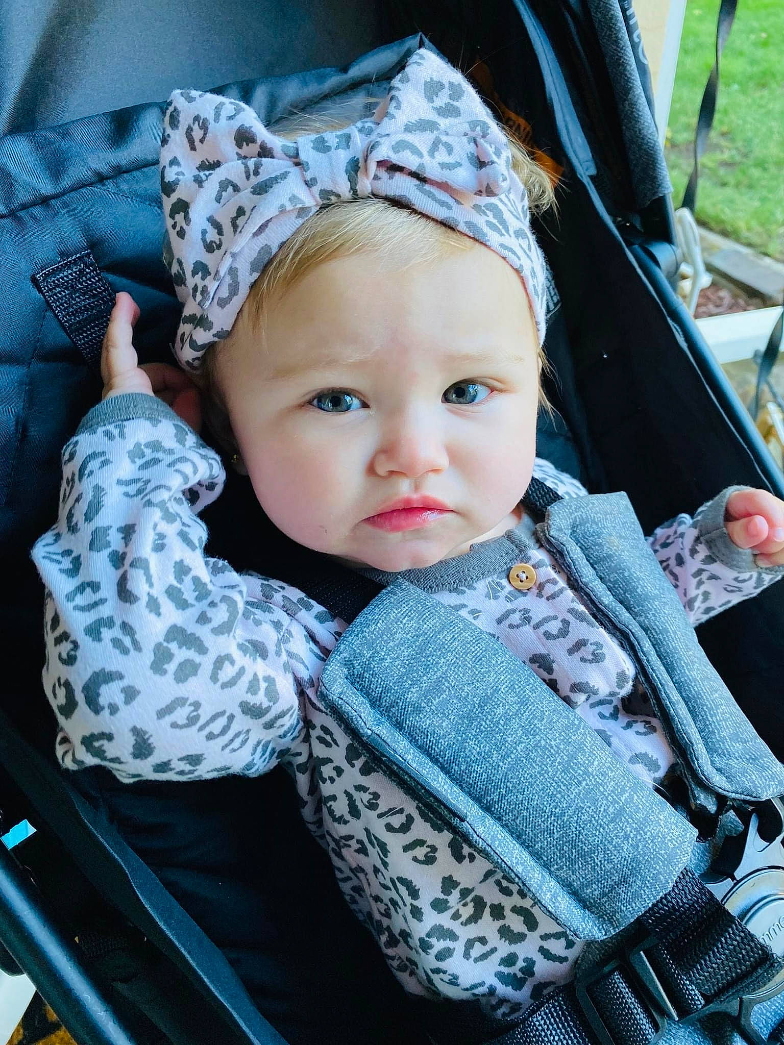 Nova is registered to the contest to win money with this photo: baby, baby_carriage, baby_products, baby_toddler_clothing, blue, cap, cheek, child, costume_hat, electric_blue, fashion_accessory, fun, grass, happy, headwear, knit_cap, pattern, person, sitting, skin