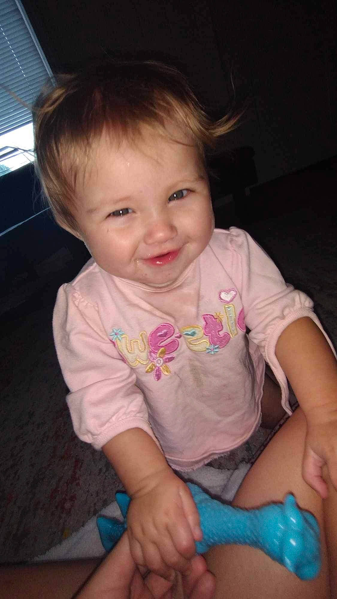 Nova is registered to the contest to win money with this photo: arm, baby_toddler_clothing, cheek, chin, ear, eyebrow, eyelash, finger, hair, hand, happy, human_body, iris, joy, lip, mouth, neck, nose, person, skin