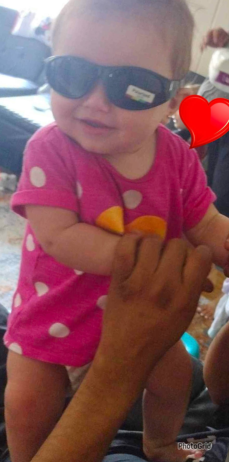 Nova is registered to the contest to win money with this photo: baby_toddler_clothing, cap, cool, eyewear, finger, fun, gesture, goggles, hand, happy, leisure, magenta, mouth, person, pink, red, skin, sunglasses, thigh, thumb