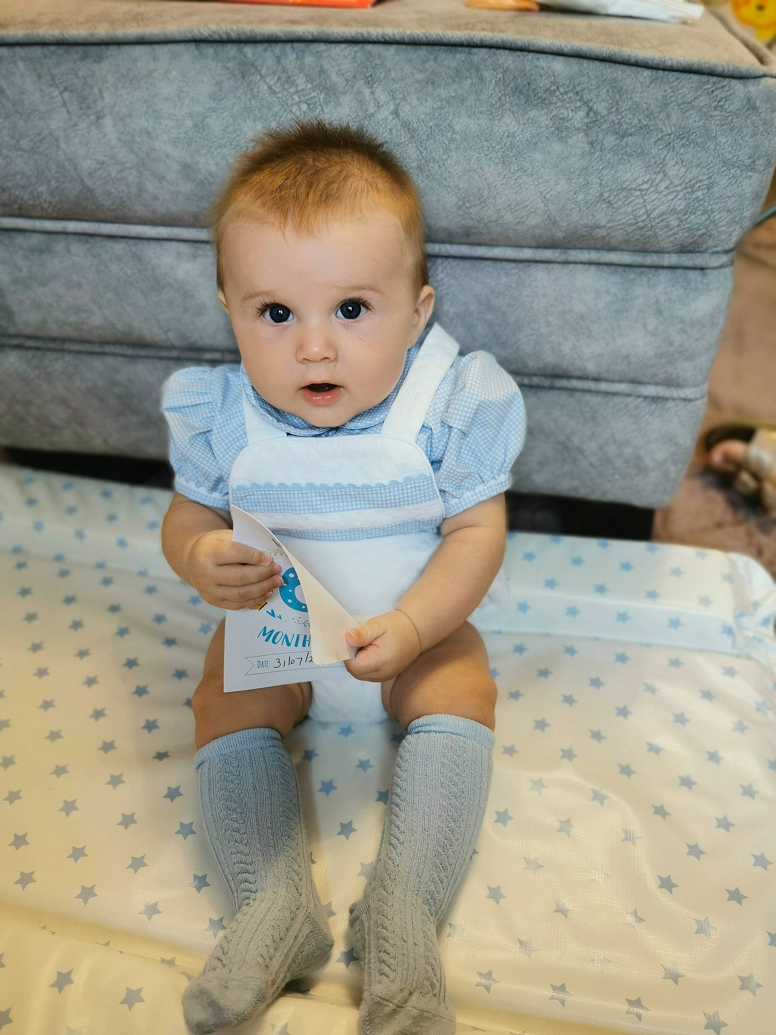 Teddy joined the competition — help win amazing prizes! baby, baby_products, baby_toddler_clothing, cheek, child, comfort, electric_blue, floor, flooring, fun, human_leg, knee, pattern, person, sitting, skin, sleeve, sock, textile, thigh