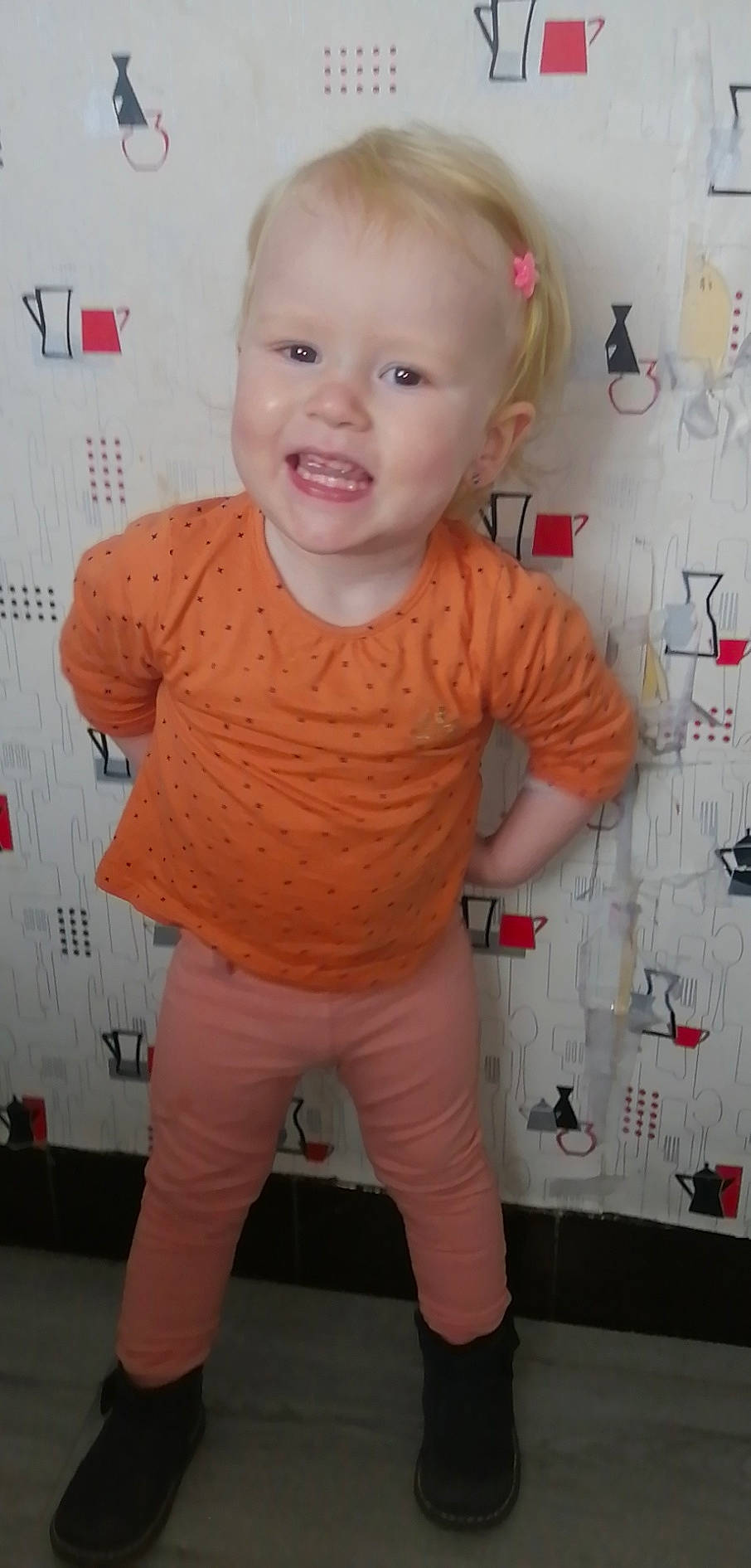 Mya participe au concours pour gagner de l'argent avec cette photo : baby_toddler_clothing, cheek, chin, eye, eyebrow, face, forehead, hairstyle, head, lip, mouth, neck, nose, person, pink, skin, sleeve, smile, standing, textile