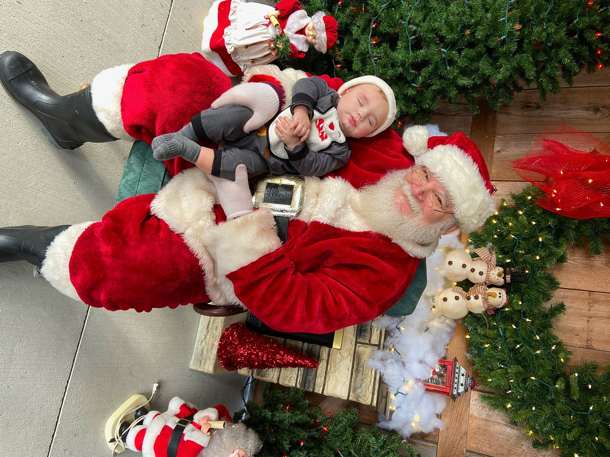 Dawson is registered to the contest to win money with this photo: carmine, christmas, christmas_decoration, christmas_eve, christmas_ornament, christmas_tree, event, fictional_character, green, happy, headwear, holiday, holiday_ornament, lap, ornament, person, plant, red, santa_claus, thigh