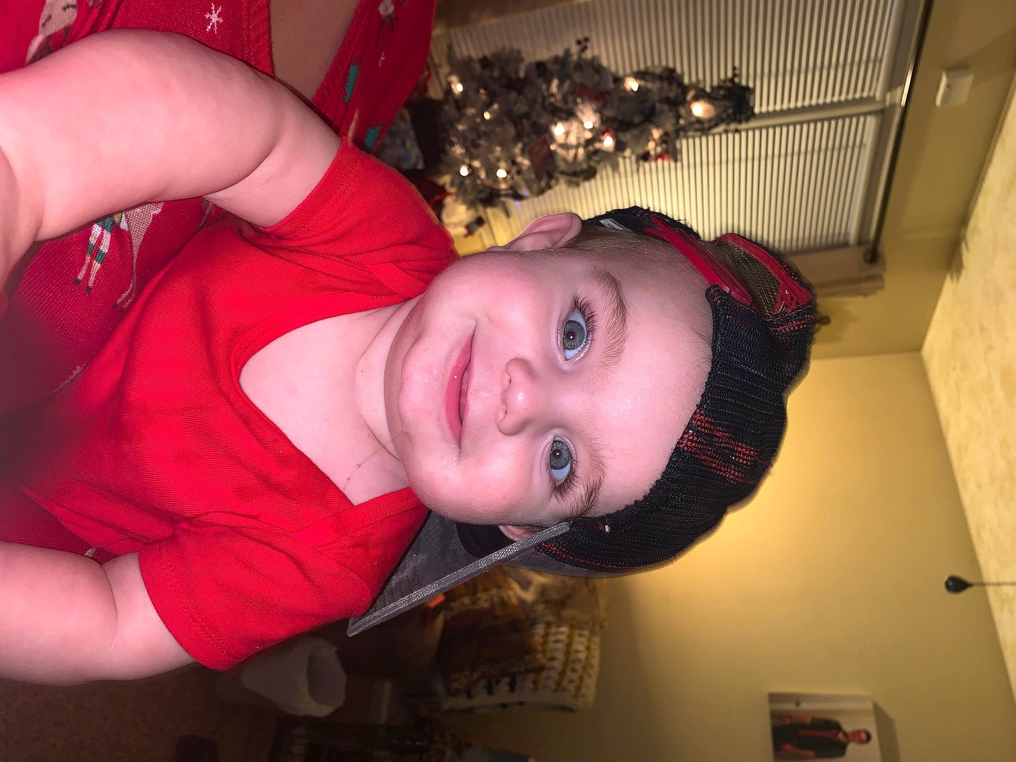 Dawson is registered to the contest to win money with this photo: black_hair, carmine, chest, child, event, eyelash, flash_photography, flesh, fun, happy, headwear, holiday, joy, lip, magenta, party, pattern, person, room, smile