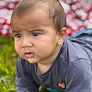 Aarón is registered to the contest to win money with this photo: baby, child, infant, crawling, grass, outdoor, curious, face, expression, clothing, long_sleeve, young, person, closeup, head, skin, eyes, nature, blurred_background, casual