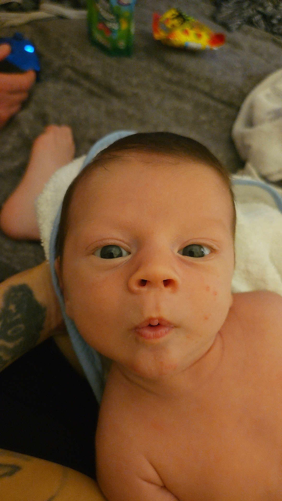 Kylo joined the competition — help win amazing prizes! baby, infant, face, eyes, expression, skin, towel, tattoo, hand, foot, indoor, closeup, person, child, portrait, curious, naked, newborn, family, candid