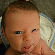 Kylo is registered to the contest to win money with this photo: baby, infant, face, expression, hand, skin, towel, newborn, closeup, portrait, child, cute, small, wrapped, person, human, eyes, mouth, fingers, indoors