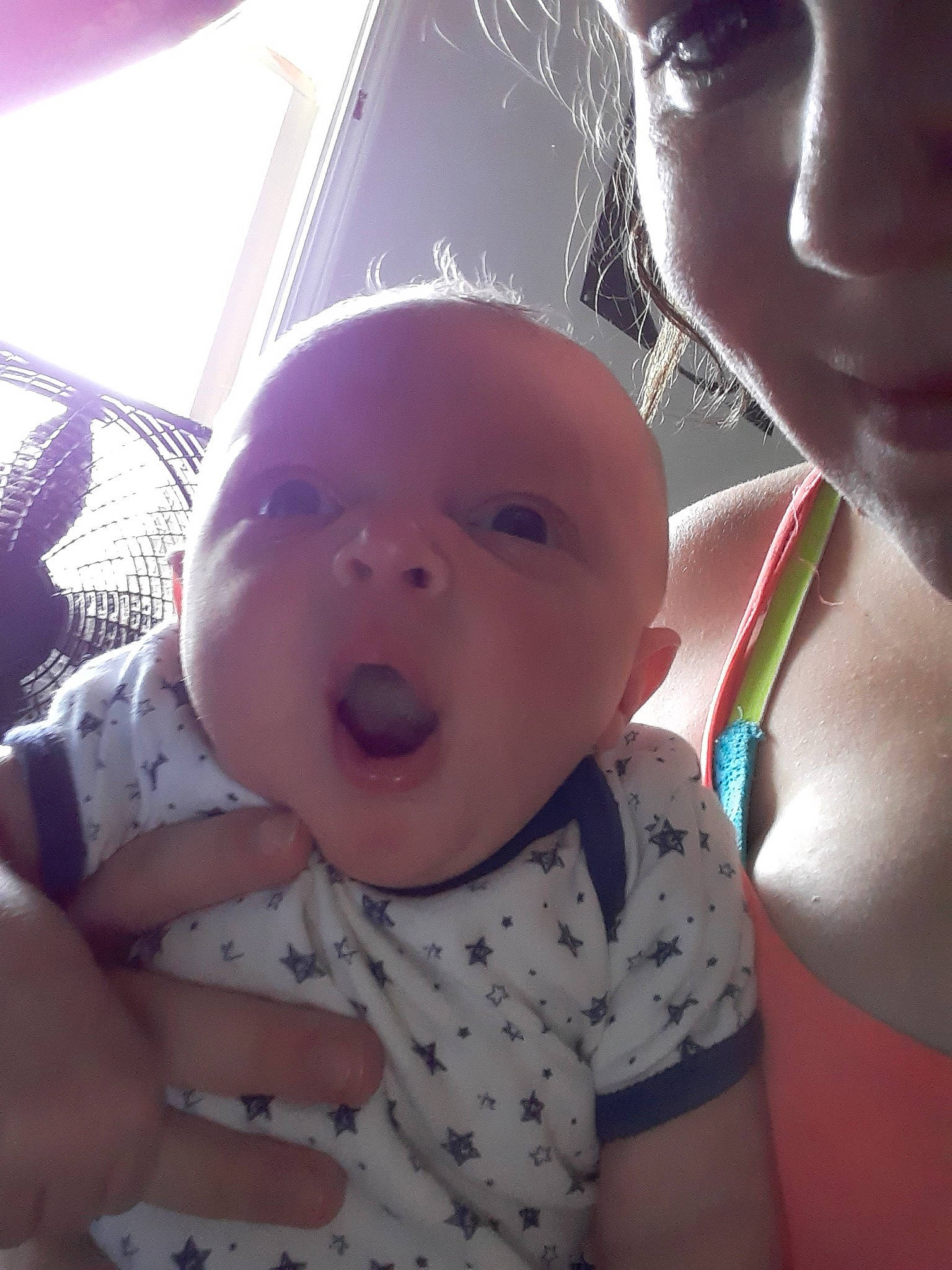 Uriah is registered to the contest to win money with this photo: baby, cheek, child, ear, electronic_device, eye, face, fun, head, lip, mouth, nose, person, selfie, skin, smile, toddler