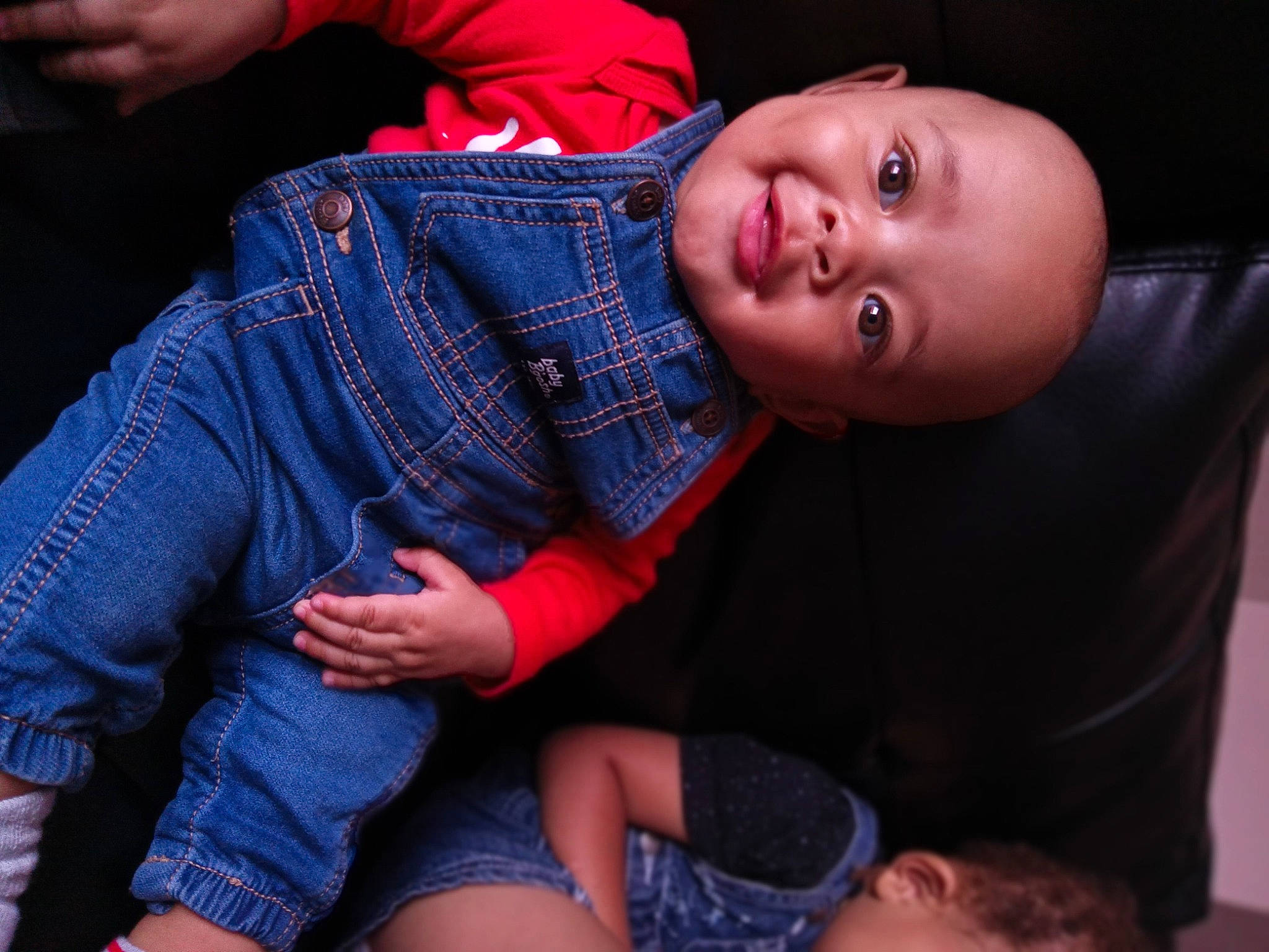Jasper is registered to the contest to win money with this photo: baby, baby_toddler_clothing, cheek, comfort, denim, elbow, electric_blue, finger, flash_photography, gesture, joint, lap, mouth, nose, organ, person, red, skin, thigh, toddler