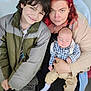 Maverick joined the competition — help win amazing prizes! child, baby, woman, family, portrait, smile, sleeping, red_hair, jacket, plaid_shirt, pants, socks, indoor, person, holding, casual_clothing, close_up, candid, happy, bond