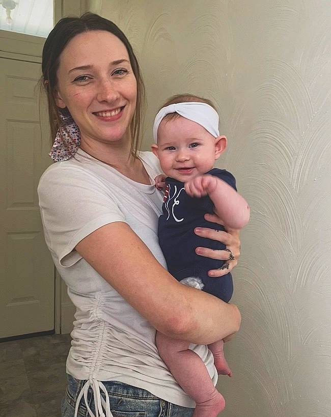 Raelynn is registered to the contest to win money with this photo: arm, baby, door, elbow, eye, face, flash_photography, gesture, hair, happy, headwear, iris, jeans, joint, joy, person, pink, shoulder, sleeve, smile