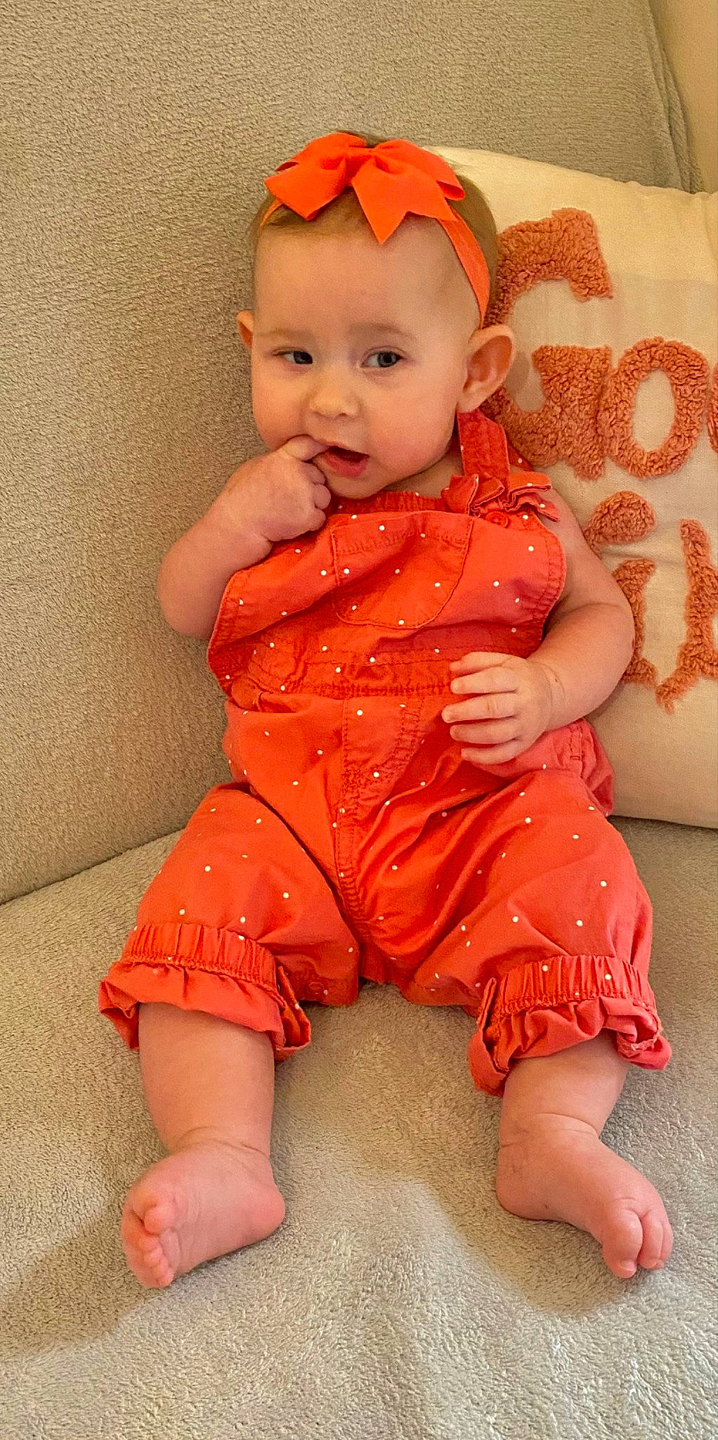 Raelynn is registered to the contest to win money with this photo: baby, baby_toddler_clothing, cheek, dress, eye, face, finger, hand, happy, head, human_body, iris, leg, lip, orange, person, pink, red, skin, sleeve