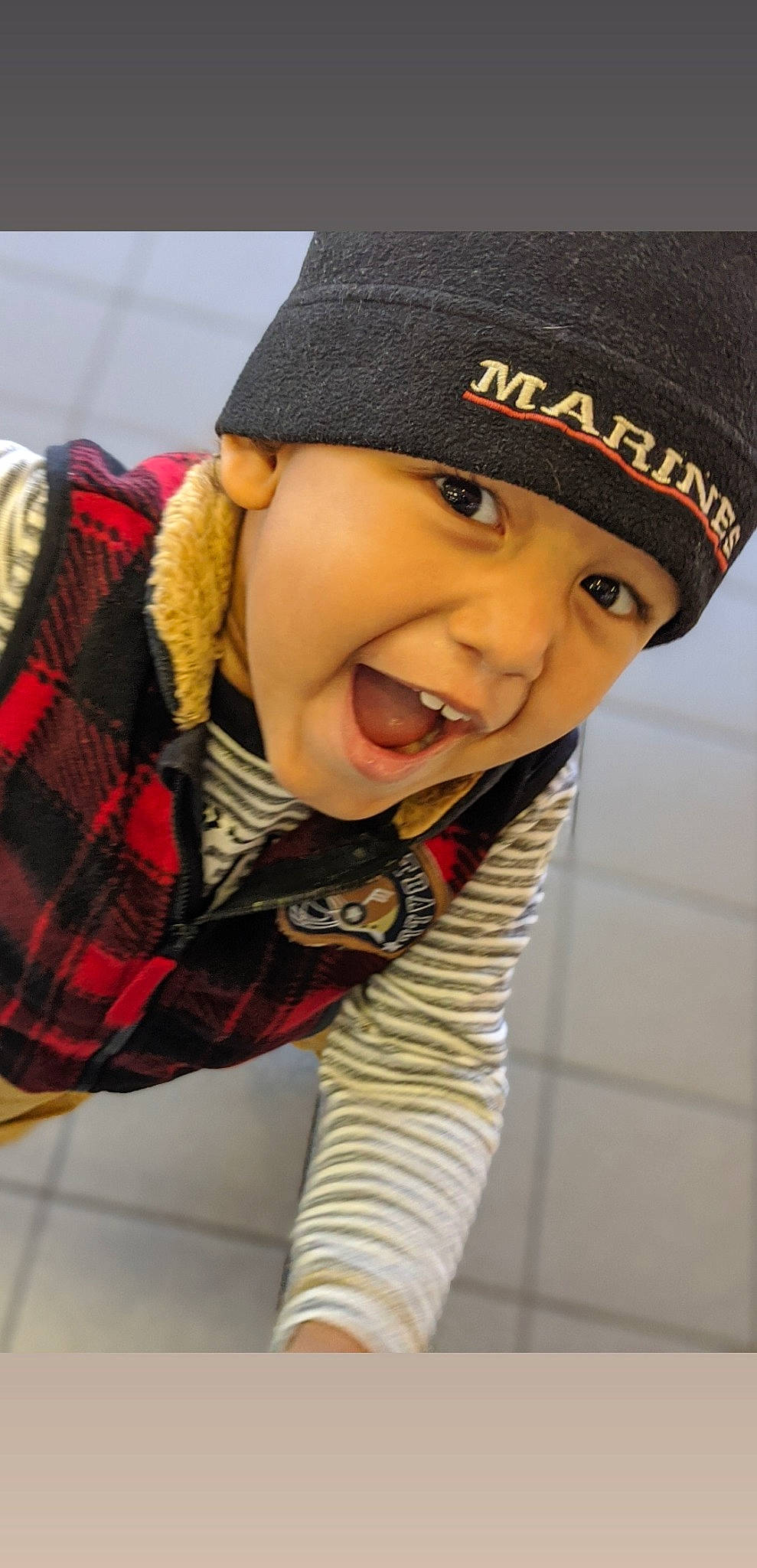 Patrick is registered to the contest to win money with this photo: beanie, cap, child, cool, hat, headgear, headwear, knit_cap, person, smile