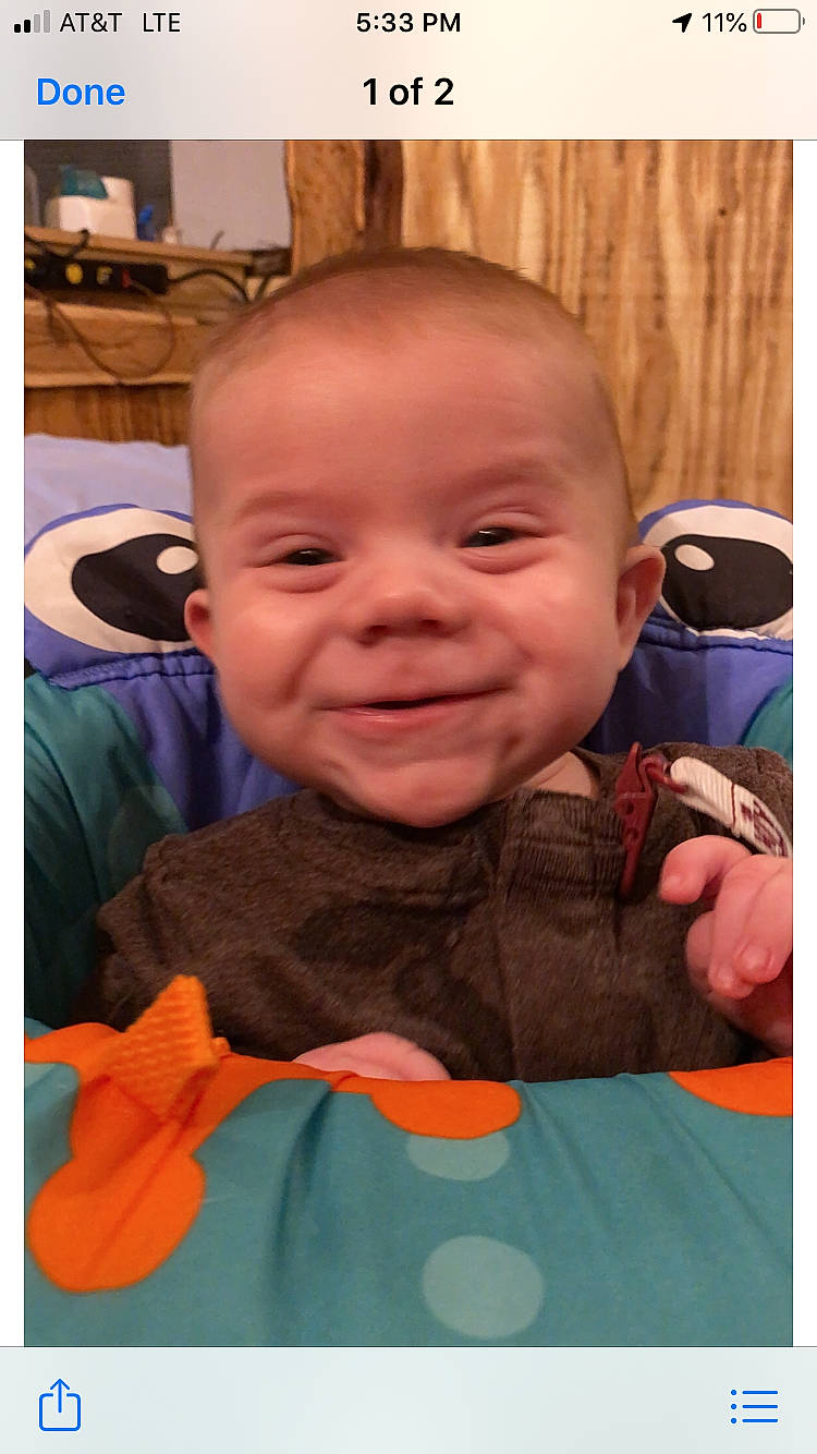 Briggs is registered to the contest to win money with this photo: baby, baby_toddler_clothing, cheek, chin, eyebrow, finger, forehead, hairstyle, happy, head, human_body, iris, joy, mouth, nose, orange, person, skin, sleeve, smile