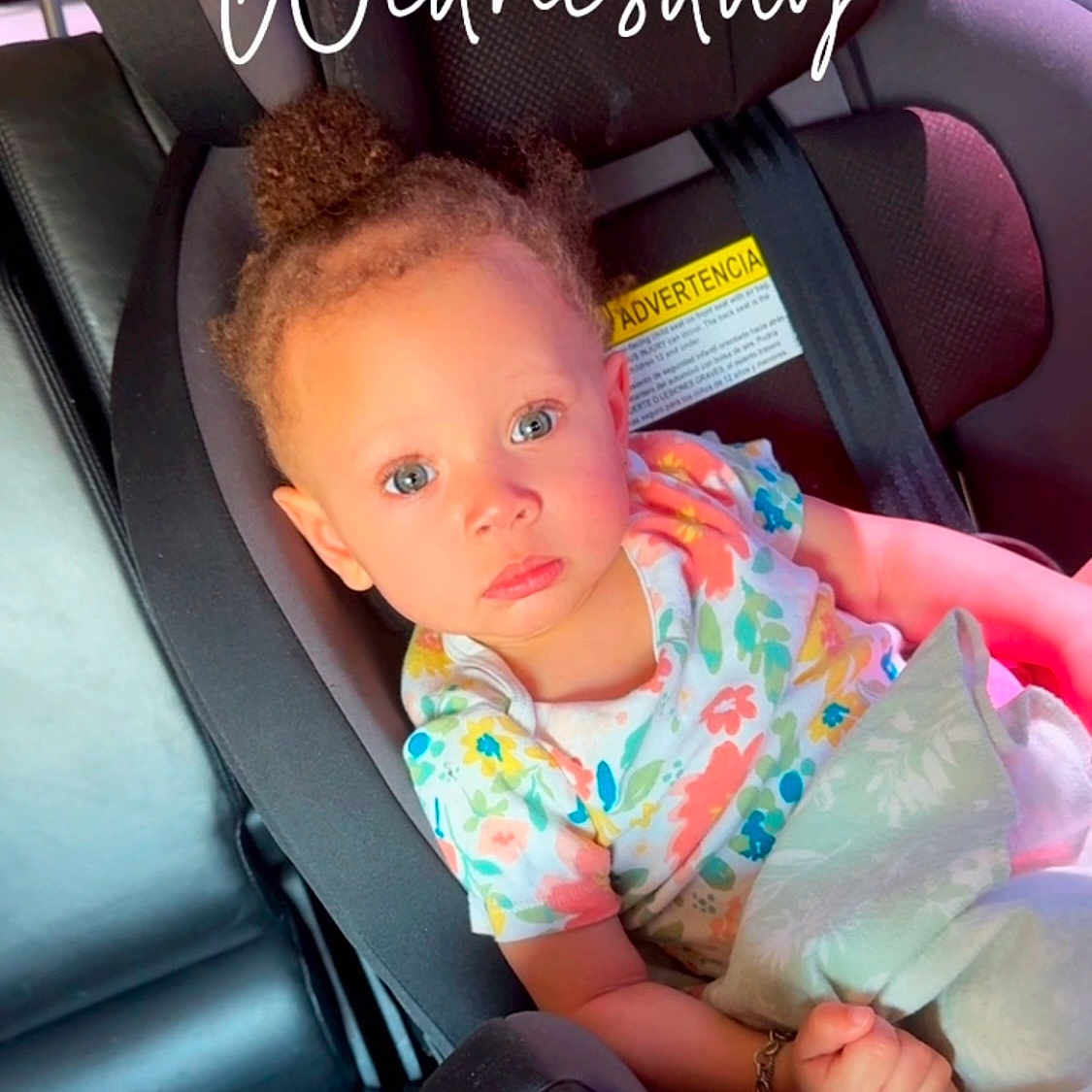 Dosha is registered to the contest to win money with this photo: accessories, baby, belt, car, car_interior, carseat, clothing, cushion, dress, face, head, headrest, homedecor, person, photography, portrait, sitting, t_shirt, transportation, vehicle