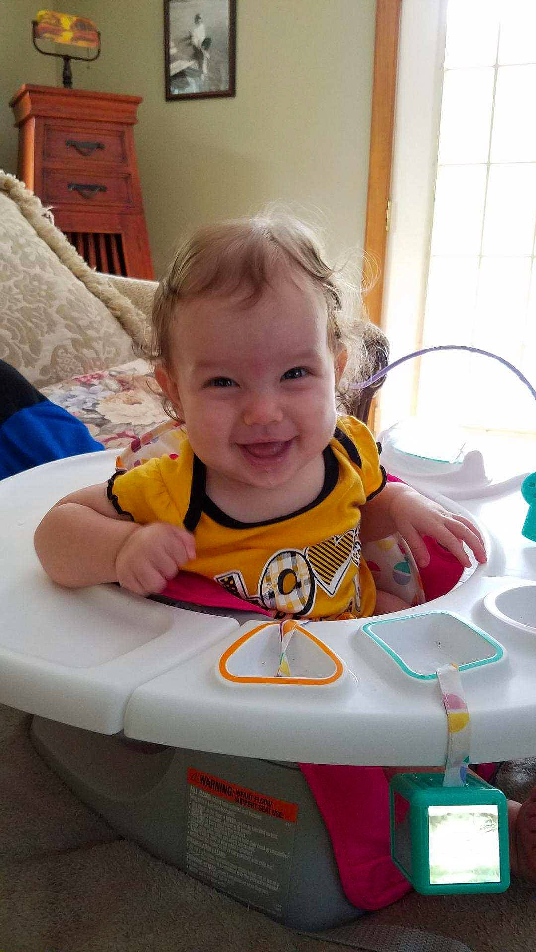 Felicity is registered to the contest to win money with this photo: baby_products, child, day, fun, furniture, infant, joy, person, play, product, sitting, smile, toddler, toy, yellow