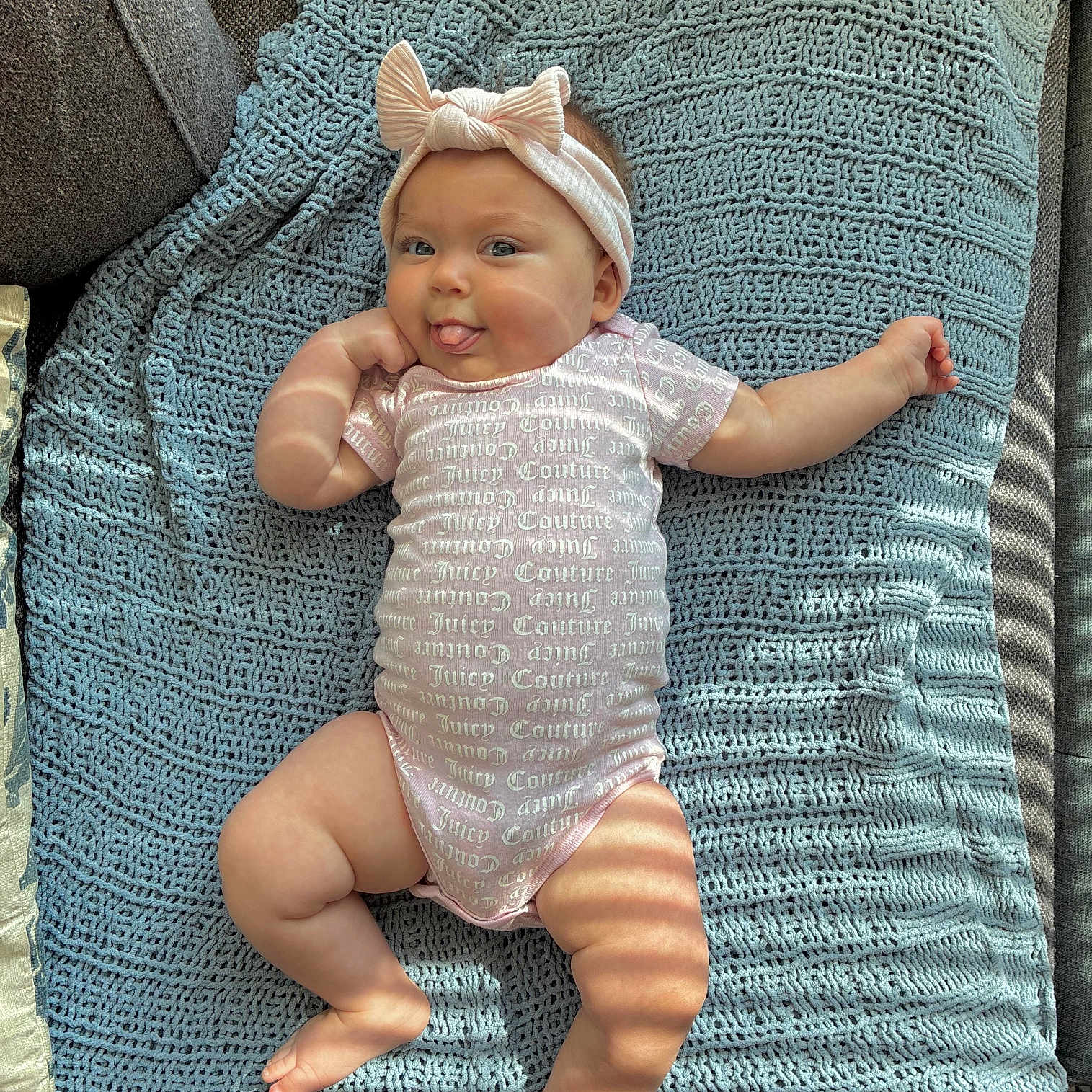 Scar joined the competition — help win amazing prizes! baby, blanket, blue, bow, chubby, couch, cute, headband, indoor, infant, knitted, light_and_shadow, onesie, person, pink, playful, skin, smiling, textile, tongue_out