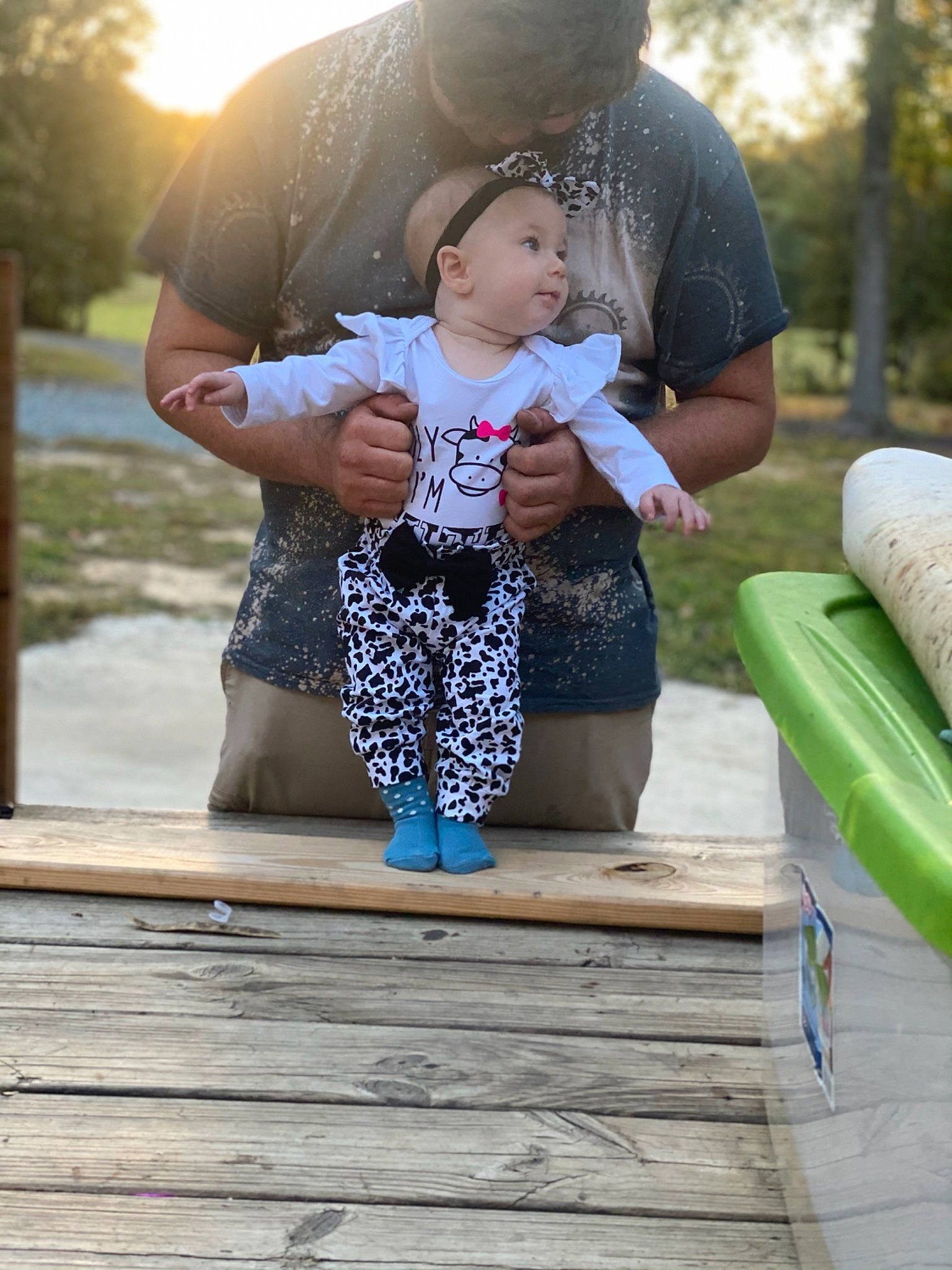 Kinsley is registered to the contest to win money with this photo: baby, child, fun, gesture, grass, happy, leisure, morning, people, people_in_nature, person, recreation, shorts, sitting, standing, summer, t_shirt, toddler, tree, vacation