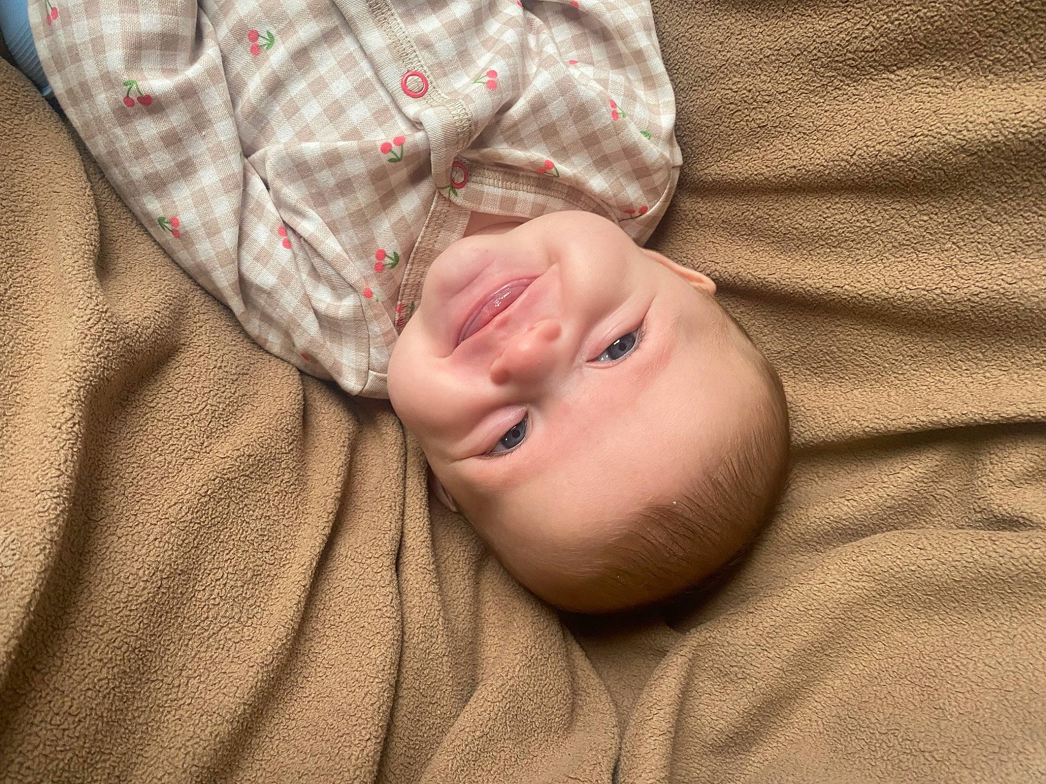 Caroline is registered to the contest to win money with this photo: baby, baby_toddler_clothing, cheek, child, comfort, eye, grass, happy, linens, pattern, person, plaid, portrait_photography, skin, sleep, sleeve, smile, tartan, toddler, wood