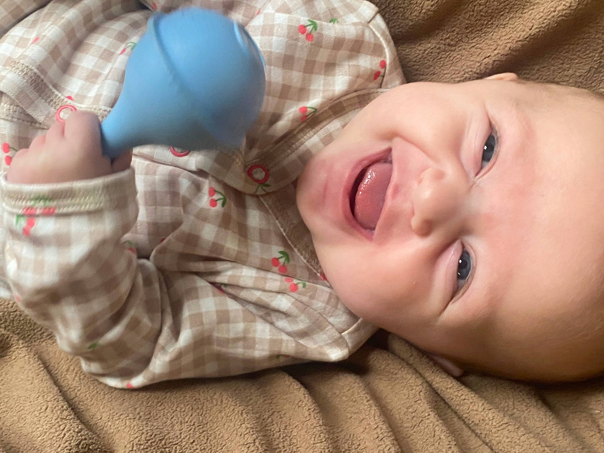 Caroline is registered to the contest to win money with this photo: baby, baby_toddler_clothing, cheek, child, comfort, eyelash, finger, grass, hand, happy, hat, nose, pattern, person, plaid, portrait_photography, sitting, skin, sleeve, smile