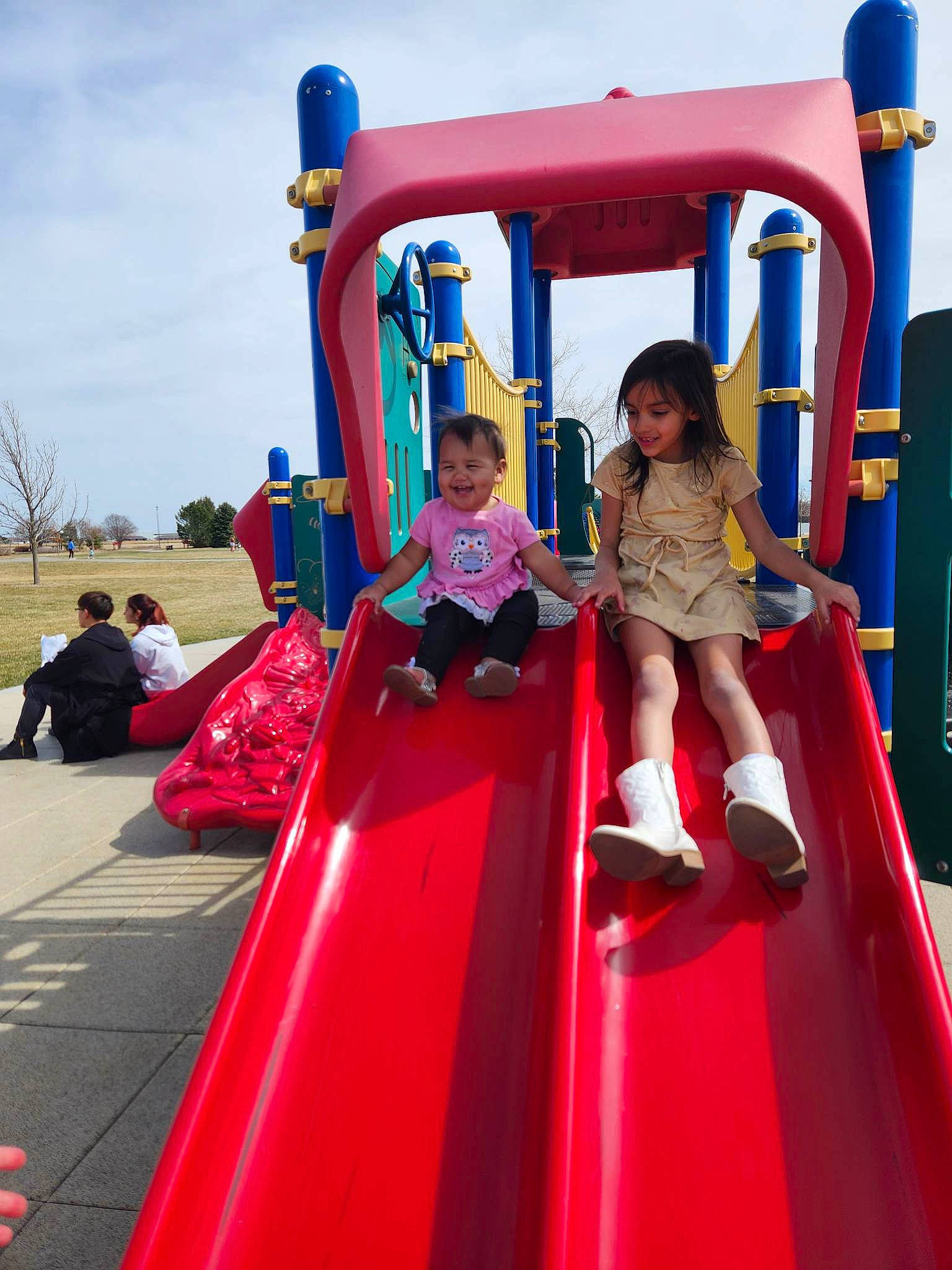 Adriana joined the competition — help win amazing prizes! amusement_ride, blue, child, chute, city, cloud, event, fun, joy, leisure, magenta, nonbuilding_structure, outdoor_play_equipment, person, play, playground, playground_slide, recreation, sky, t_shirt