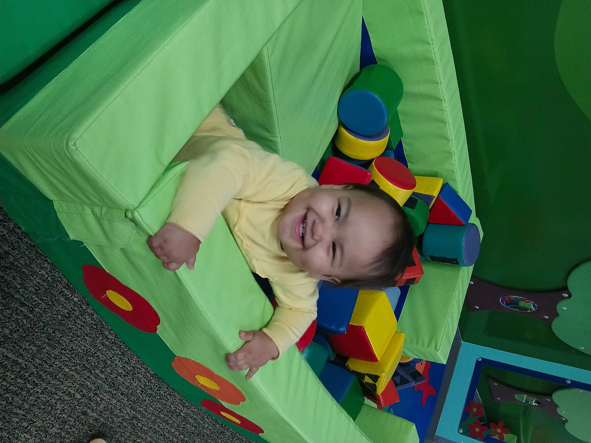 Adriana is registered to the contest to win money with this photo: baby, baby_products, baby_toys, child, comfort, flooring, fun, grass, joy, leisure, linens, nap_mat, pattern, people_in_nature, person, play, playmat, recreation, room, t_shirt