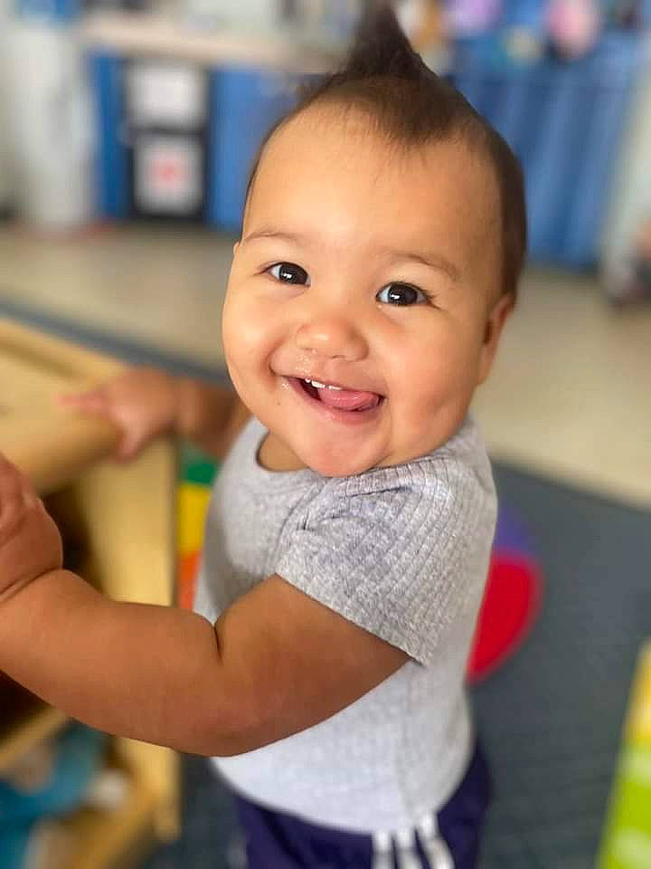 Adriana is registered to the contest to win money with this photo: baby, baby_products, baby_toddler_clothing, cheek, child, eye, fun, gesture, hair, happy, human_body, iris, joy, laugh, leisure, person, play, room, skin, smile