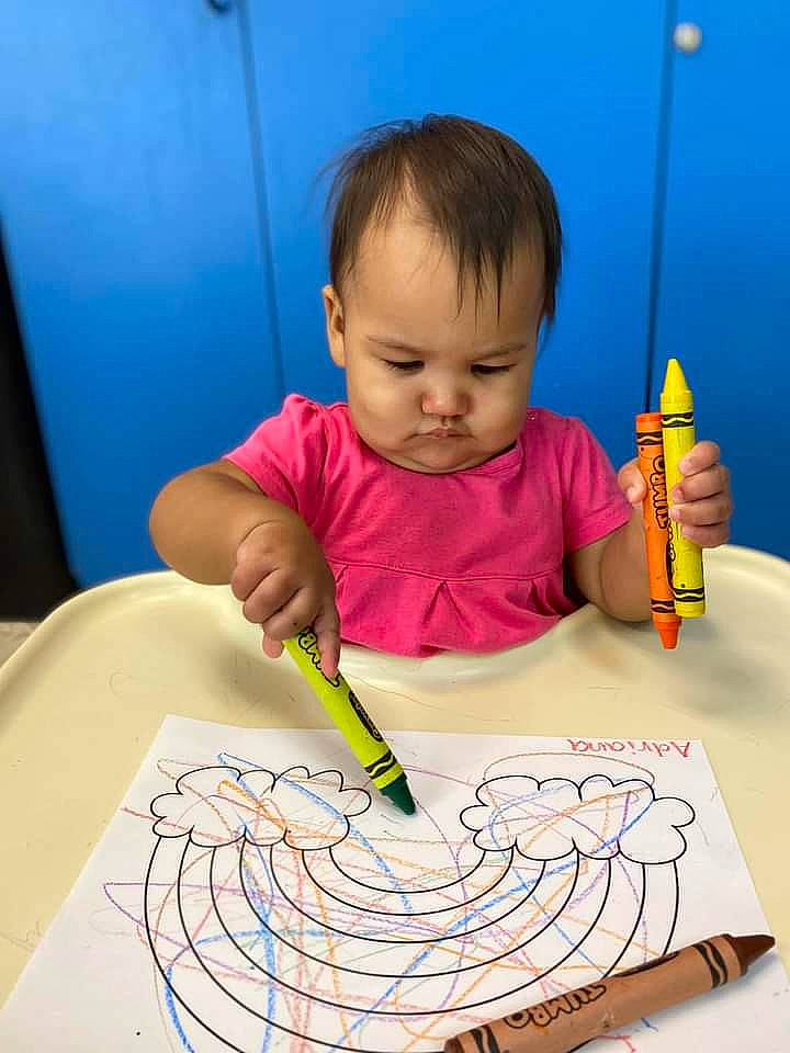 Adriana is registered to the contest to win money with this photo: art, artist, baby, child, desk, eyelash, finger, fun, hand, homework, illustration, office_supplies, person, sweetness, t_shirt, table, tableware, toddler, writing, writing_implement
