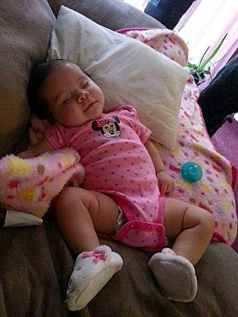 Malena joined the competition — help win amazing prizes! baby, baby_toddler_clothing, cheek, child, comfort, couch, finger, hand, knee, lap, leg, linens, person, pink, product, skin, sleeve, smile, textile, thigh