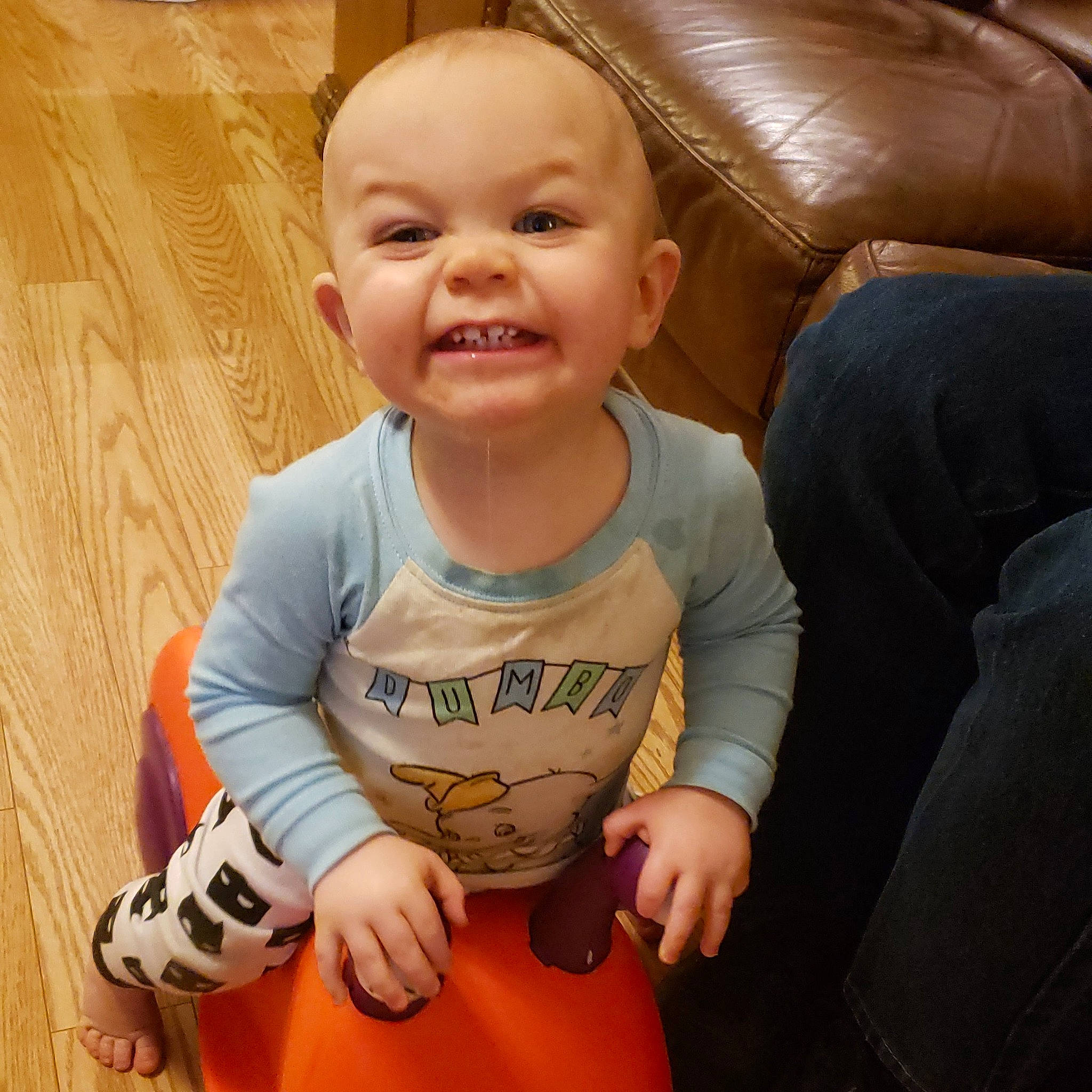 Bradley is registered to the contest to win money with this photo: baby, baby_laughing, baby_products, baby_toddler_clothing, cheek, child, comfort, couch, finger, joy, laminate_flooring, lap, laugh, mouth, person, play, sock, thumb, toddler, tongue