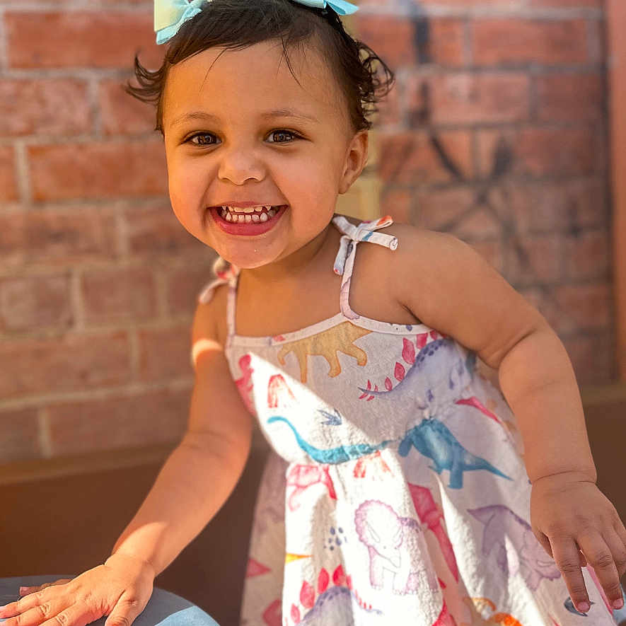 Remaya is registered to the contest to win money with this photo: bodypart, child, clothing, cream, dessert, dress, face, female, finger, food, girl, hand, happy, head, mouth, person, photography, portrait, smile, teeth